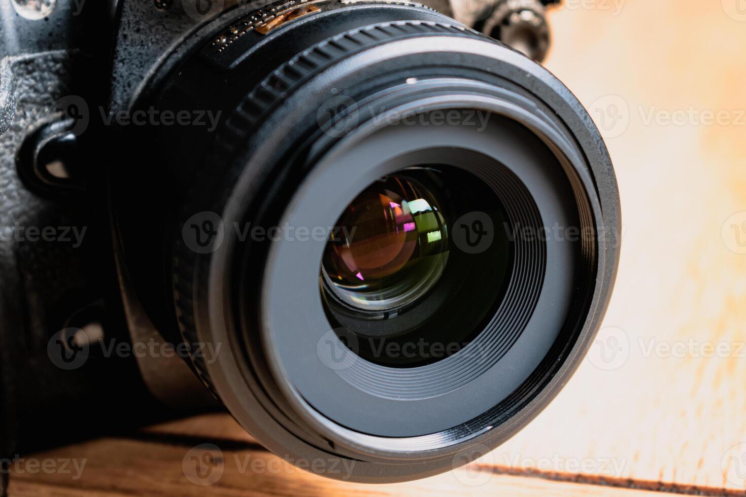 Reflex camera or dslr with reflexion on lens, photograph equipment, for professionnal and agency photo