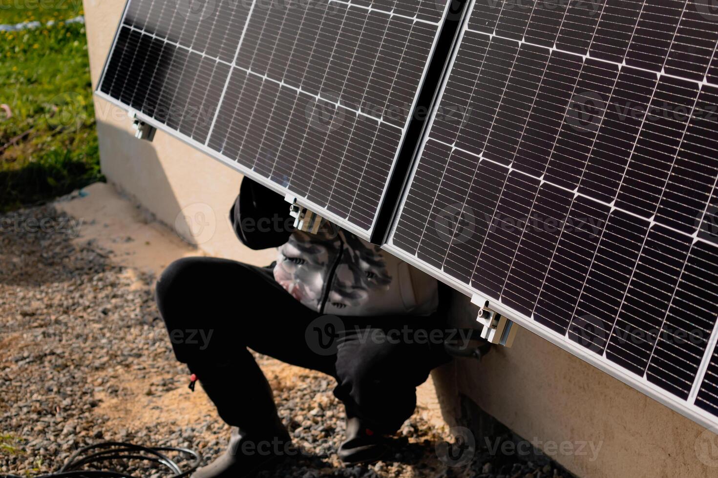 Solar panels on a well-exposed wall of an individual house, making savings following the energy crisis, eco-citizen gesture, green energy photo