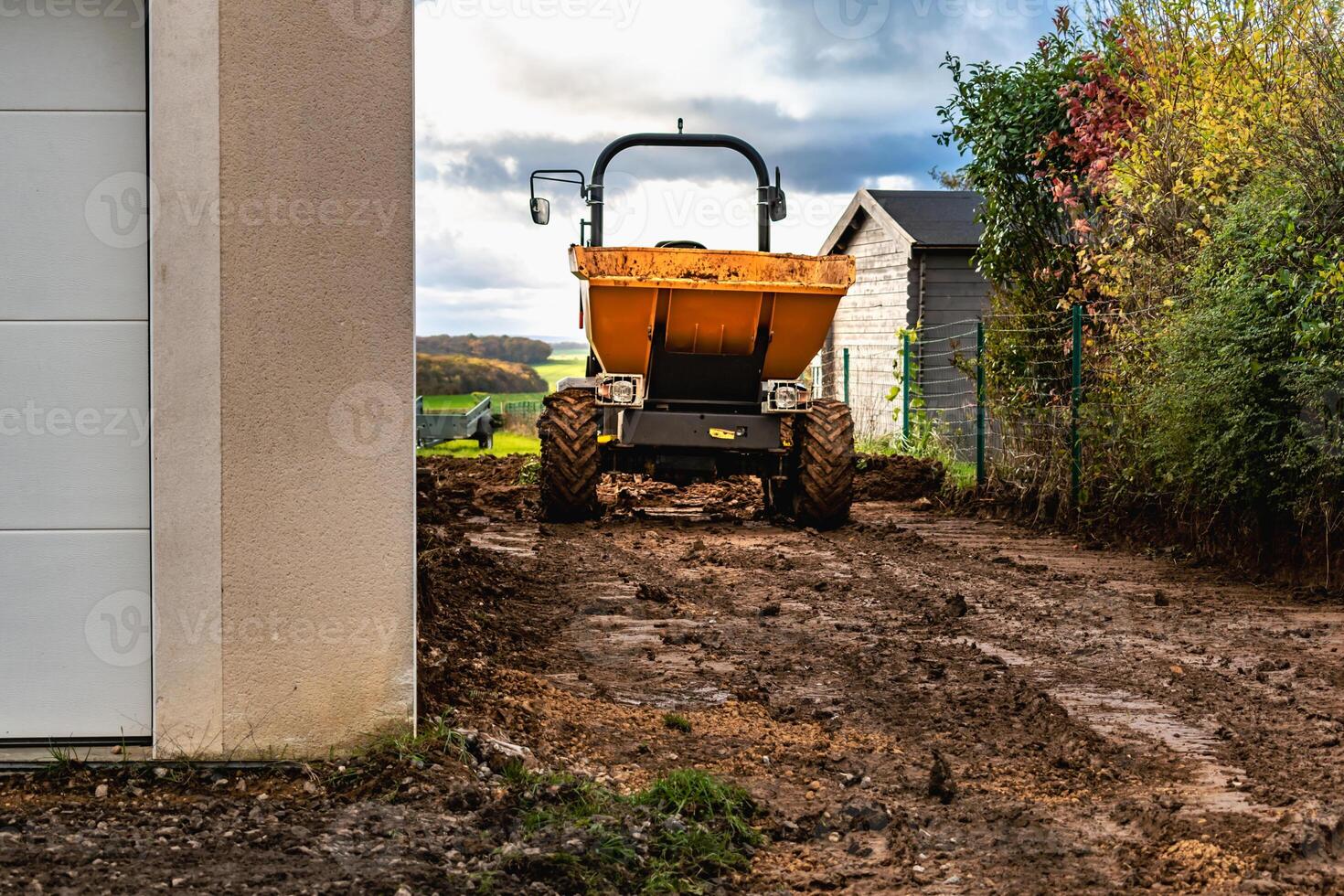 Dump truck to transport gravel to an earthmoving site photo