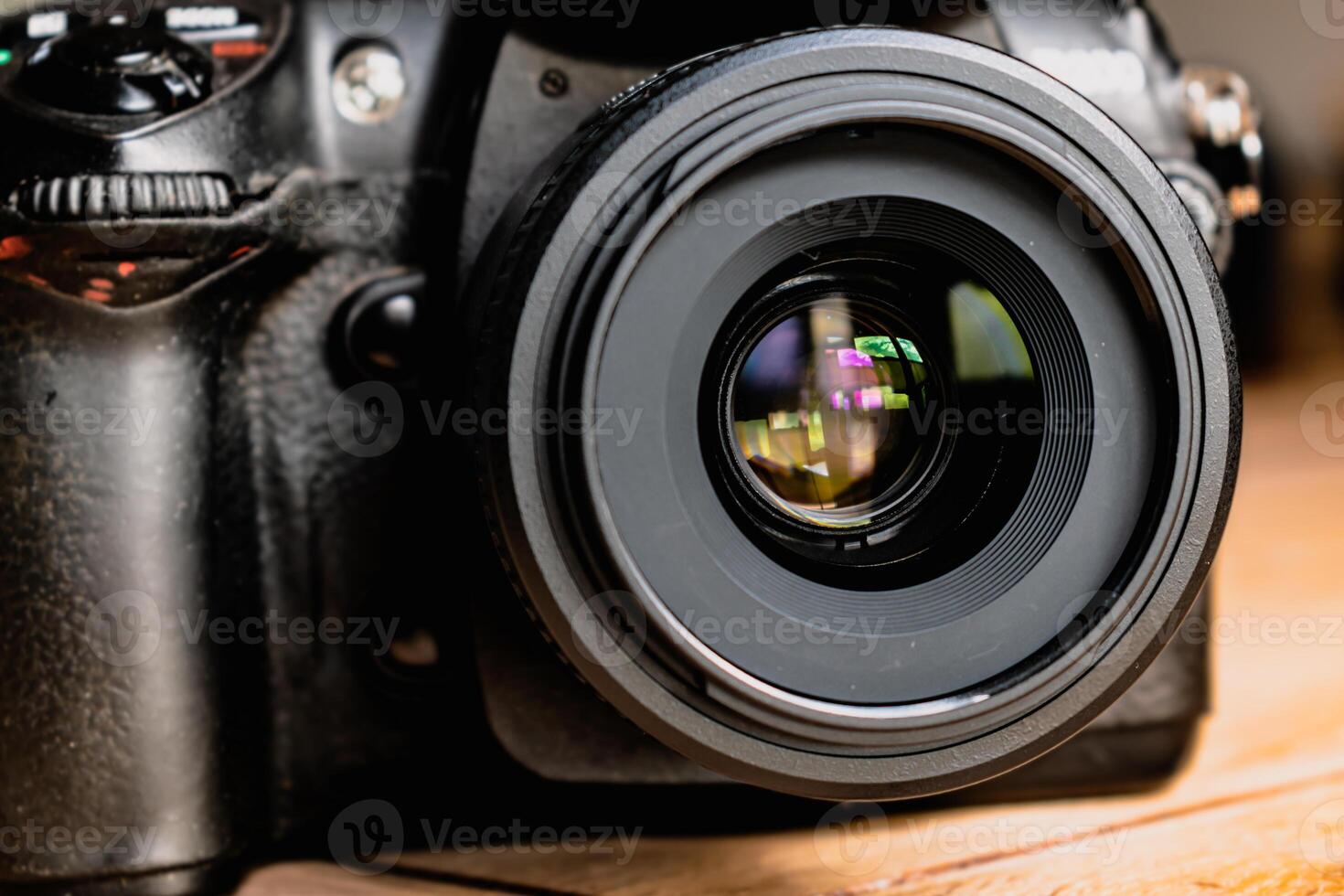 Reflex camera or dslr with reflexion on lens, photograph equipment, for professionnal and agency photo