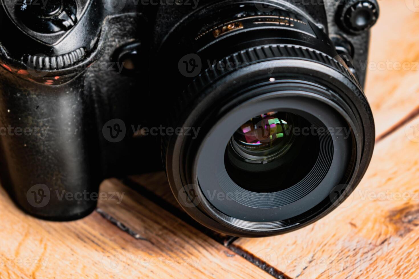 Reflex camera or dslr with reflexion on lens, photograph equipment, for professionnal and agency photo