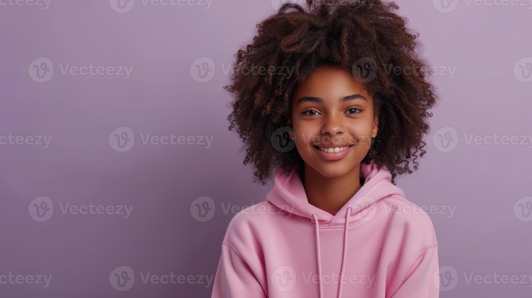 AI Generated A young happy African American boy holding a digital tablet computer while browsing the net, elearning and wearing a purple hoodie. photo