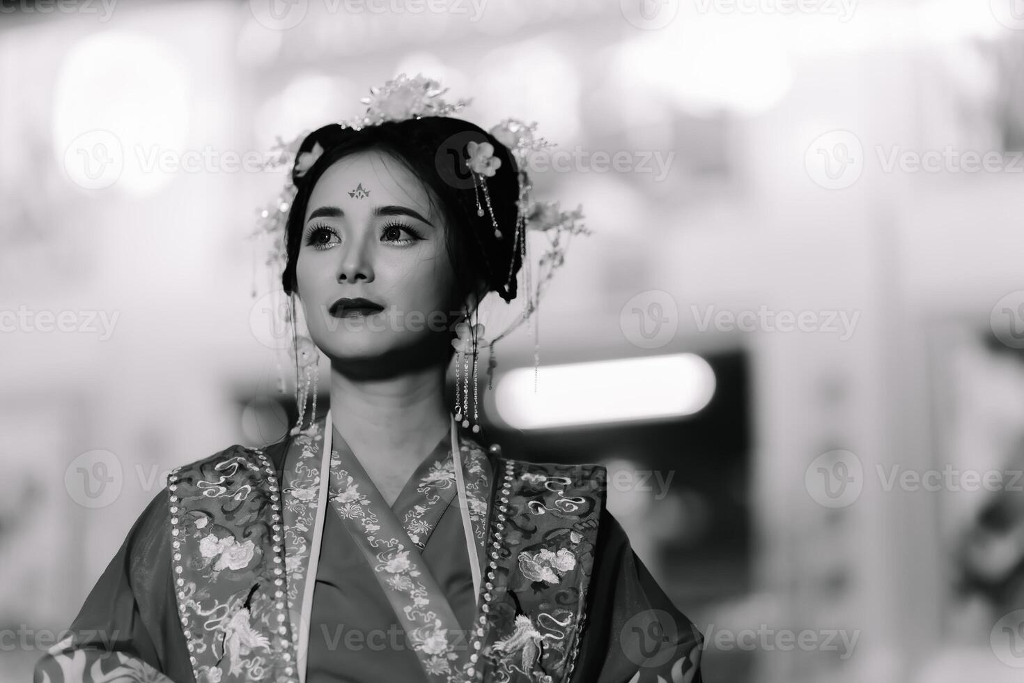 Woman dress China New year. portrait of a woman. person in traditional costume. woman in traditional costume. Beautiful young woman in a bright red dress and a crown of Chinese Queen posing. photo