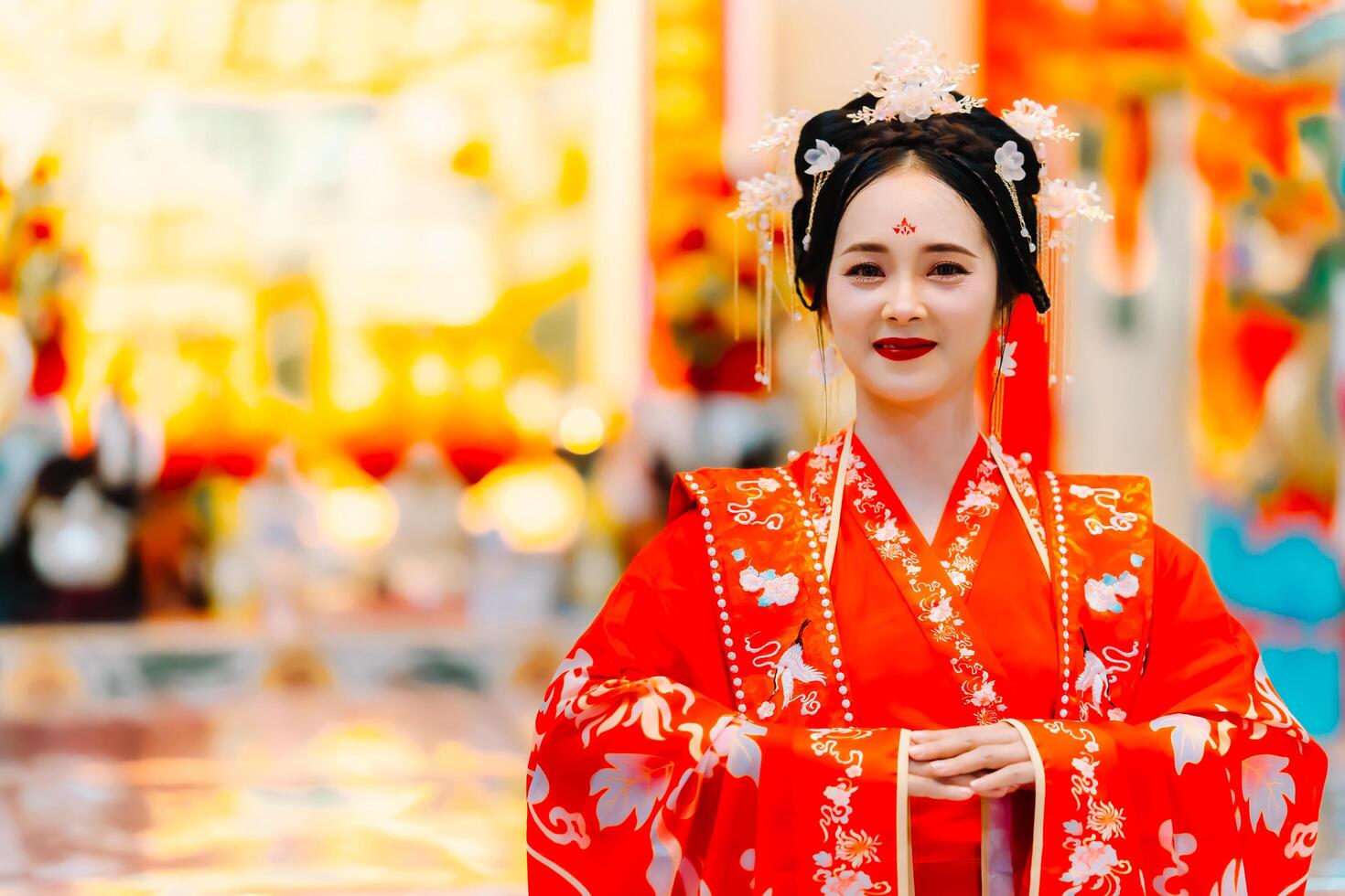 Woman dress China New year. portrait of a woman. person in traditional costume. woman in traditional costume. Beautiful young woman in a bright red dress and a crown of Chinese Queen posing. photo