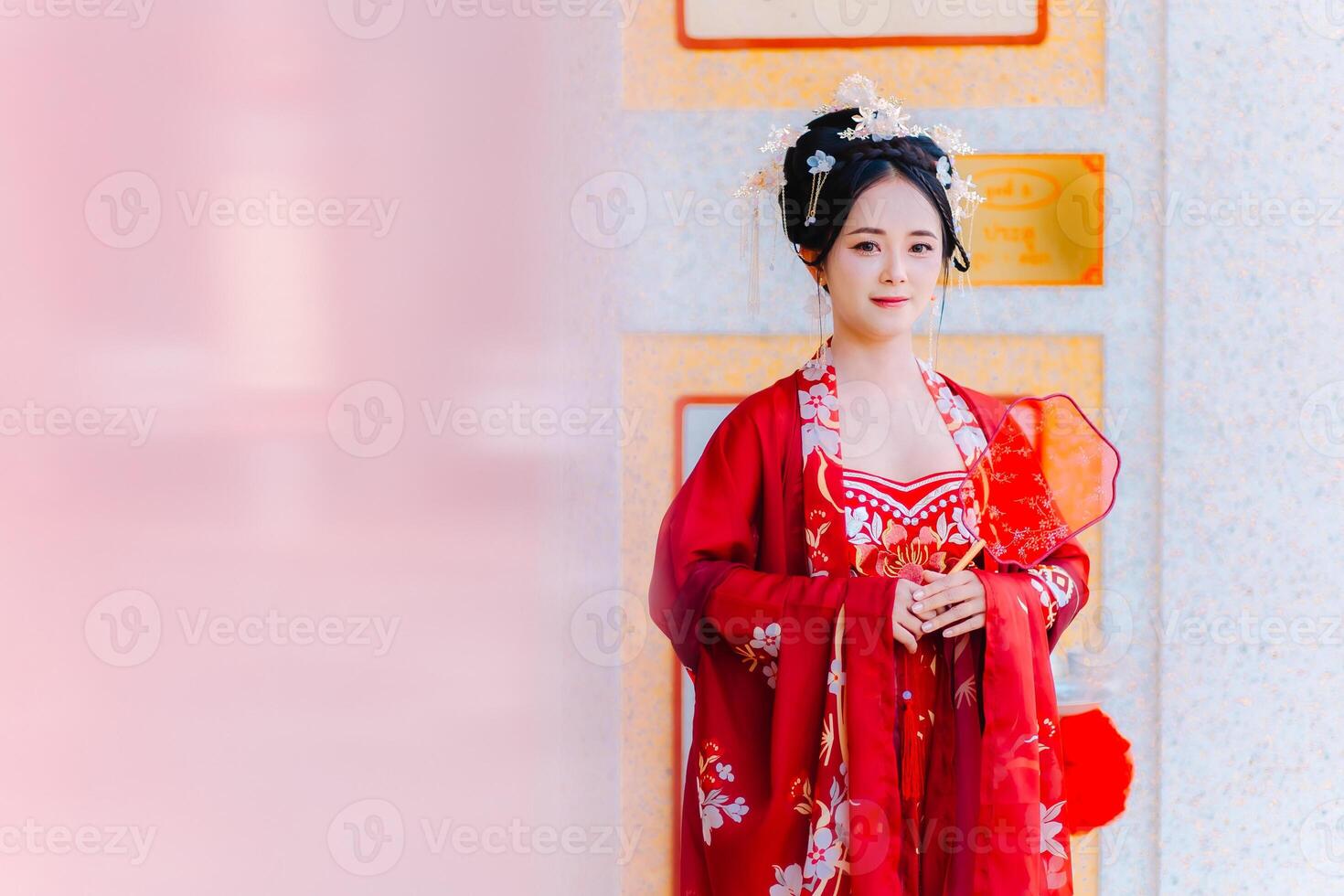 Woman dress China New year. portrait of a woman. person in traditional costume. woman in traditional costume. Beautiful young woman in a bright red dress and a crown of Chinese Queen posing. photo