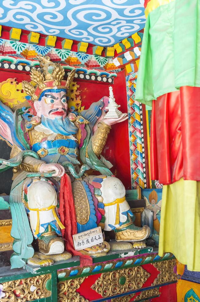 Shuzheng, Sichuan, China, 2015, Statue inside a Buddhist temple, Shuzheng Tibetan village, Jiuzhaigou National Park, Sichuan Province, China, Unesco World Heritage Site photo