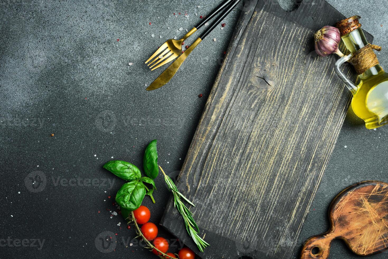 Cooking table with herbs, spices and utensils. Top view with copy space photo