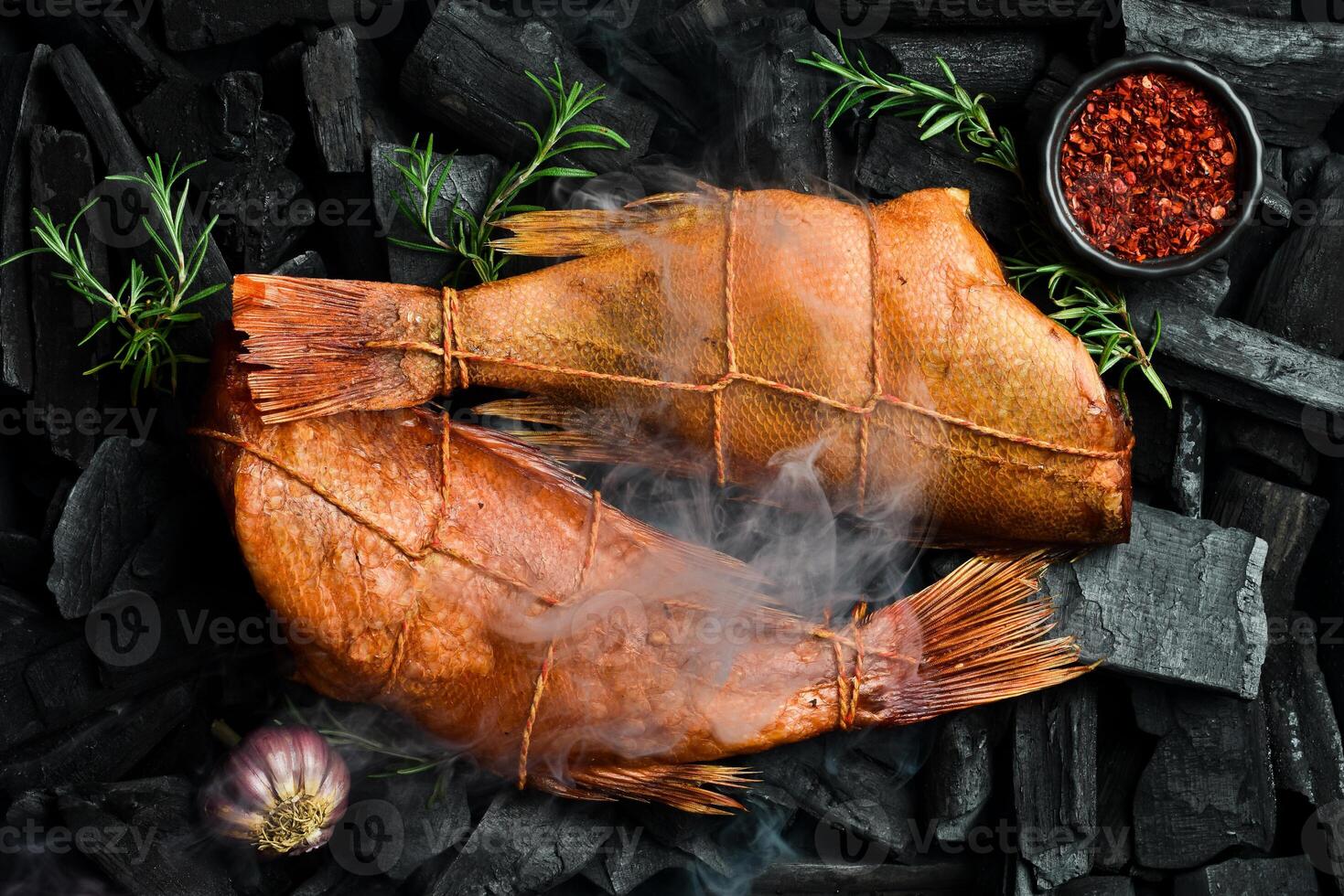 Hot smoked red sea bass on hot charcoal. Barbecue. Cooking fish. Charcoal. photo