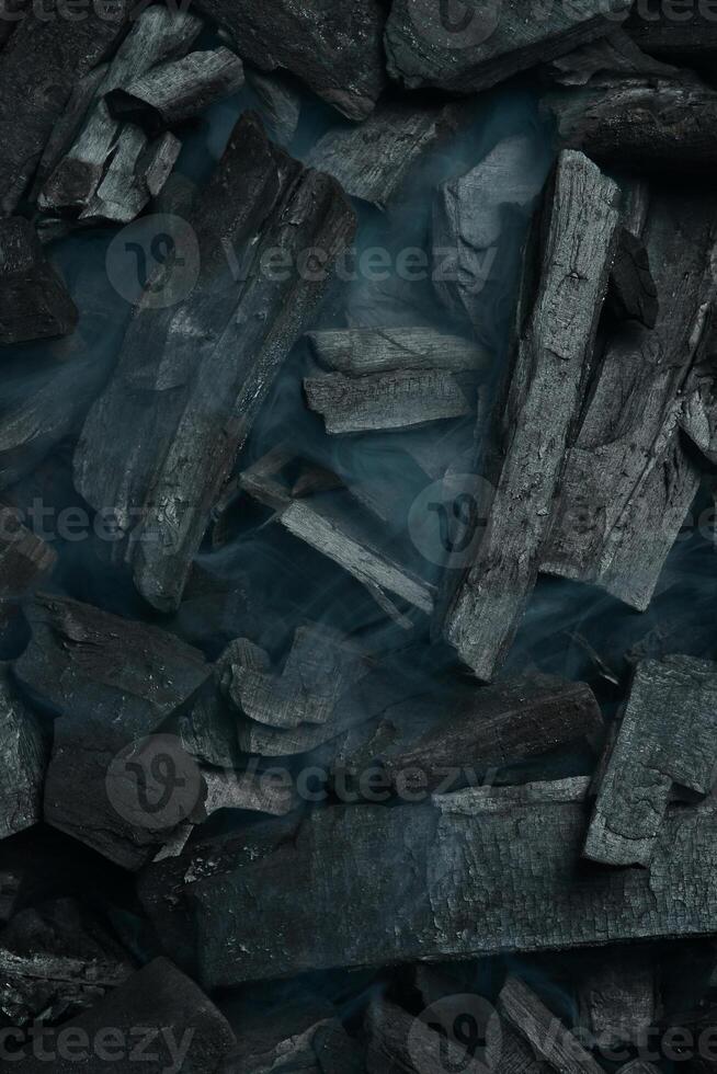 texturizado carbón antecedentes. negro carbón. parte superior vista. espacio para texto. foto