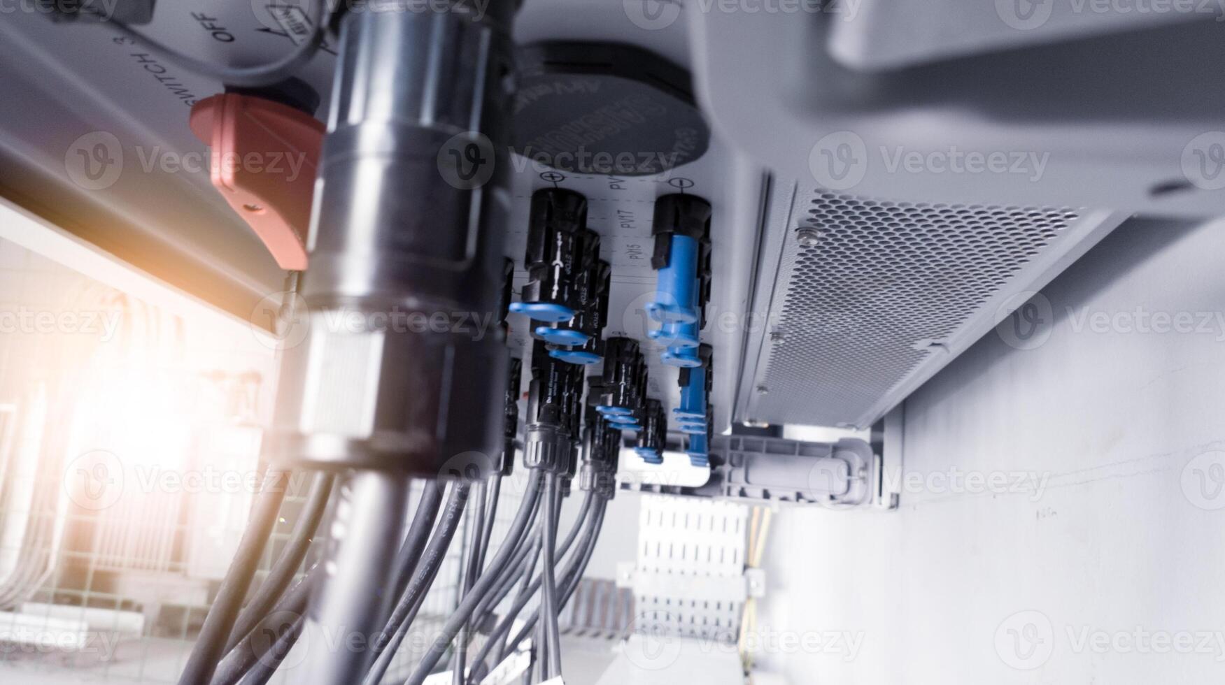 Cable connecting the power from the solar panel to the inverter with shiny light. Cable string connection on inverter control solar panel. Socket input supply voltage and Technology of solar energy. photo