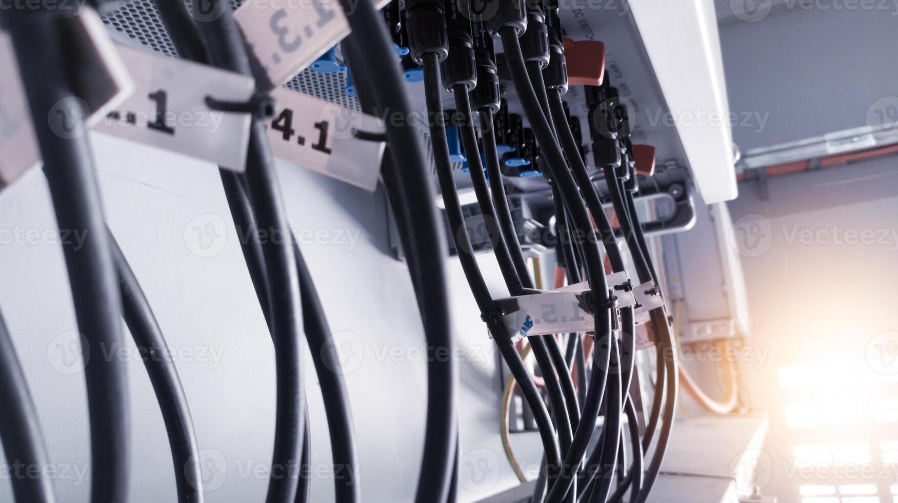 Cable connecting the power from the solar panel to the inverter with shiny light. Cable string connection on inverter control solar panel. Socket input supply voltage and Technology of solar energy. photo