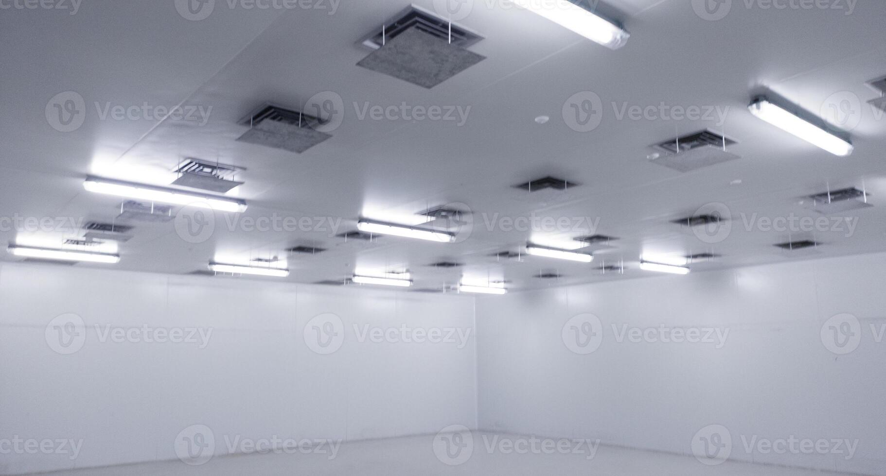 Close-up of a installation a long LED light bulb on the ceiling corridor room. photo