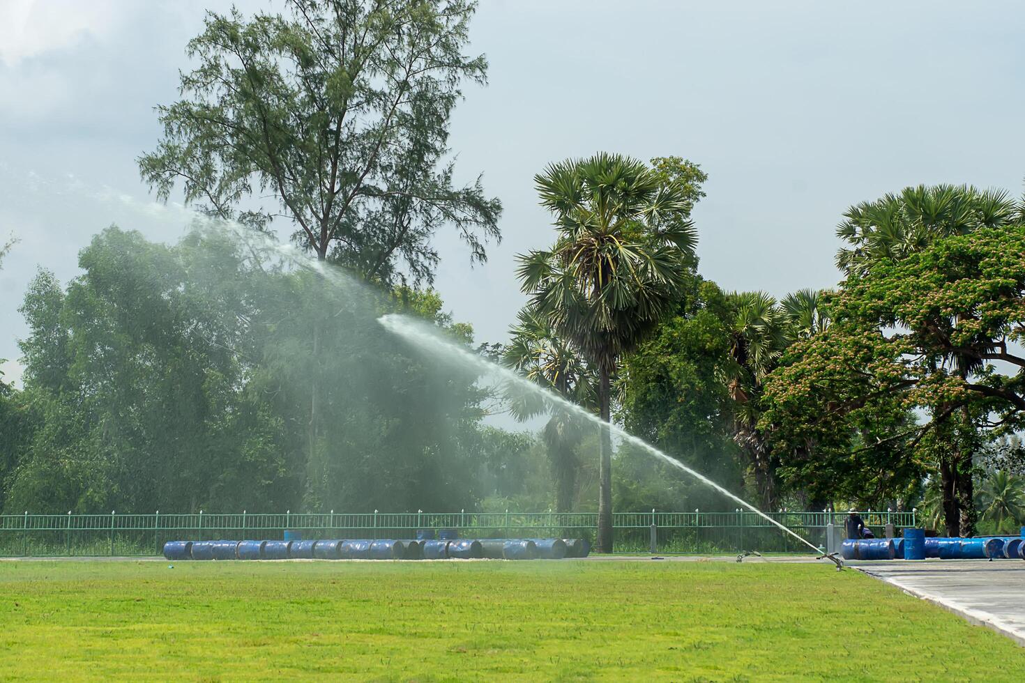 Water sprinkler in the stadium. photo