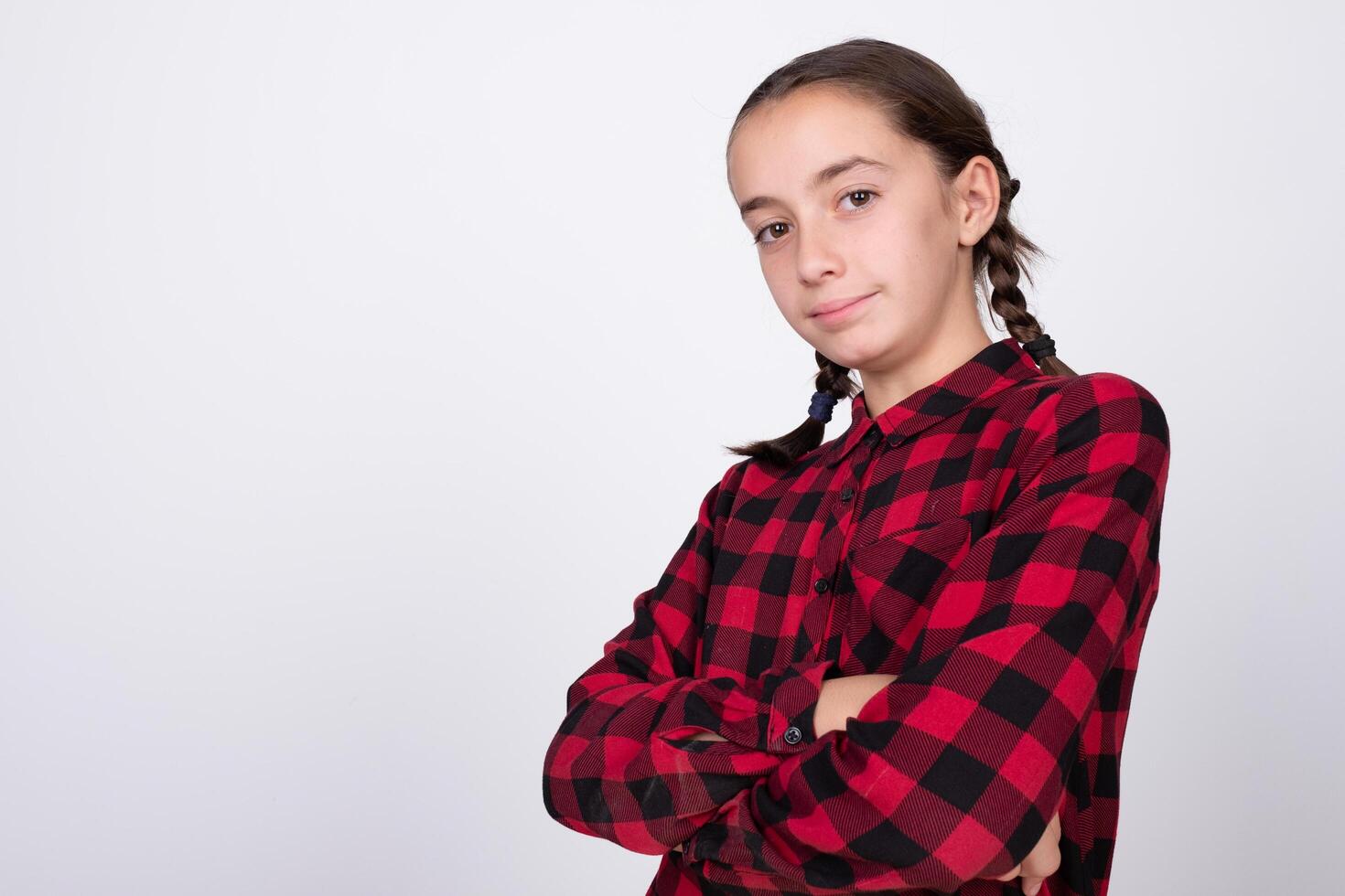 girl posing with crossed arms and a very nice hairstyle photo