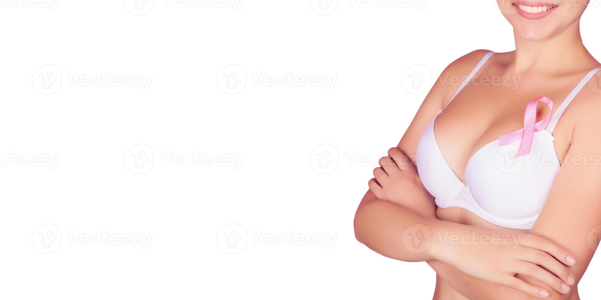 Young woman examining her breast for lumps or signs of breast cancer. Pink Ribbon. isolated on white background photo