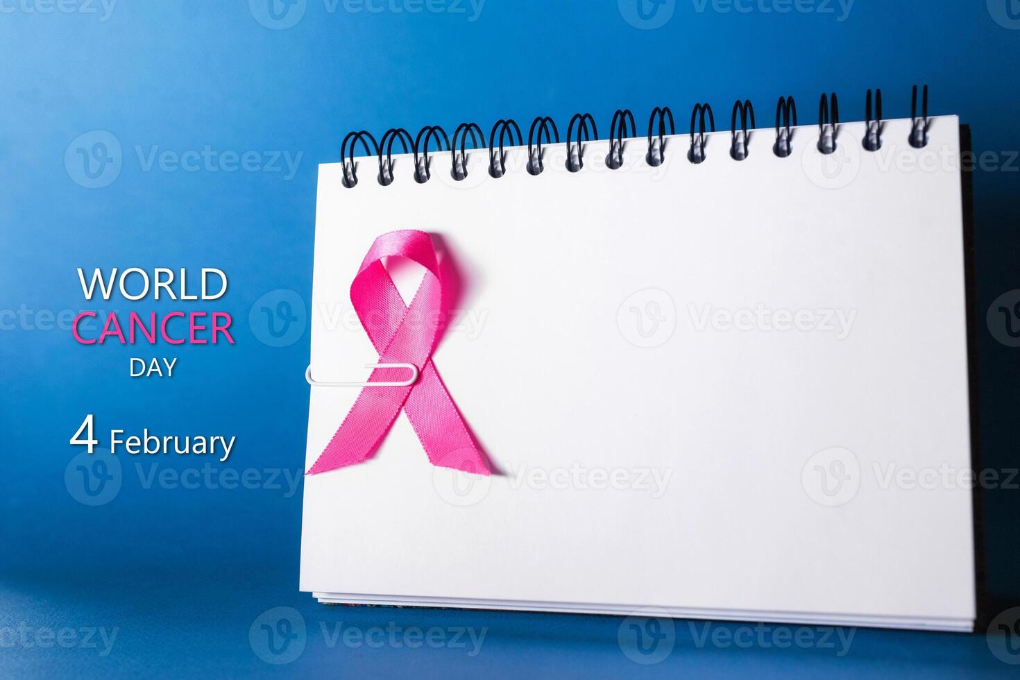 World cancer day concept on white background. World prostate cancer day concept. Awareness blue ribbon. Women healthcare concept. White background. Stop prevention concept. photo