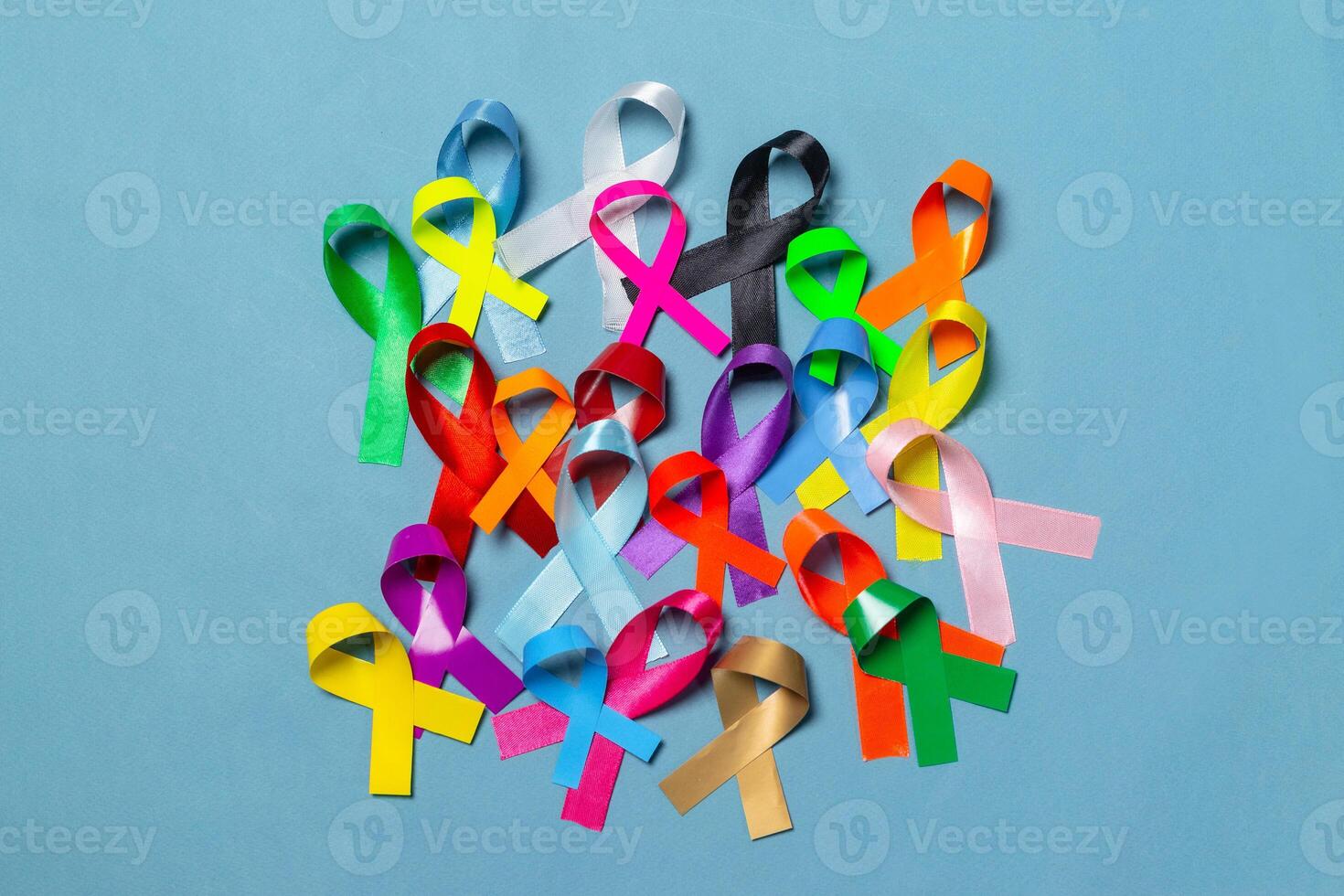 World Cancer Day. Colorful ribbons, cancer awareness, blue background. International Agency for Research on Cancer photo