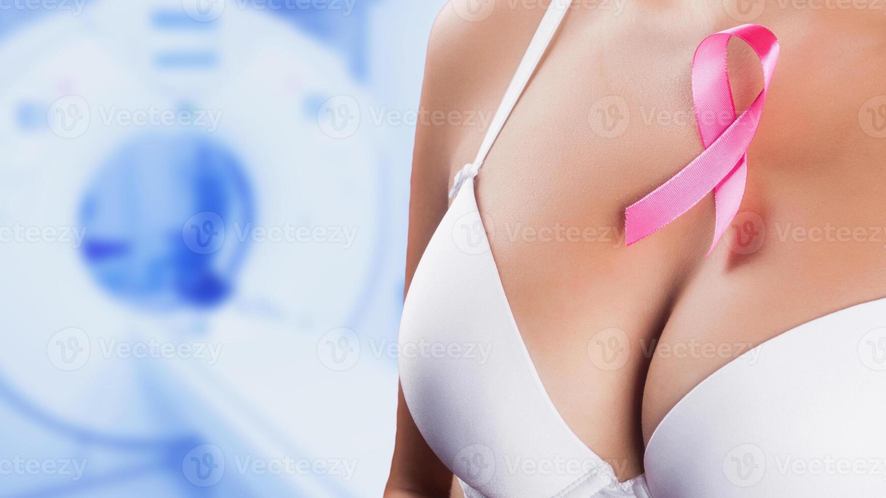 slim woman figure with pink ribbon across fer breast, cancer concept photo