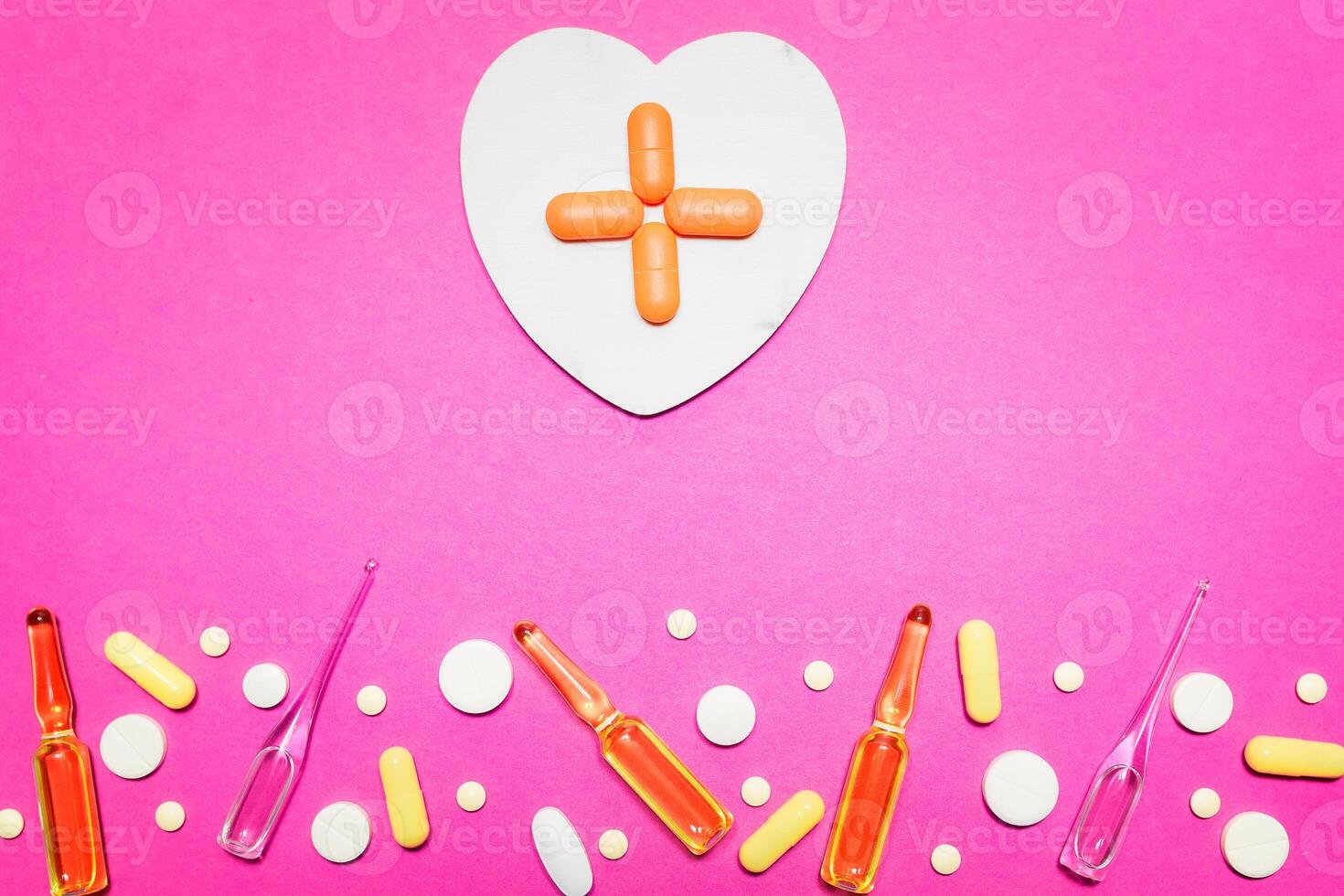 pharmaceutical medical pink background. Top view of the pills, ampoules, pills. Place for text photo