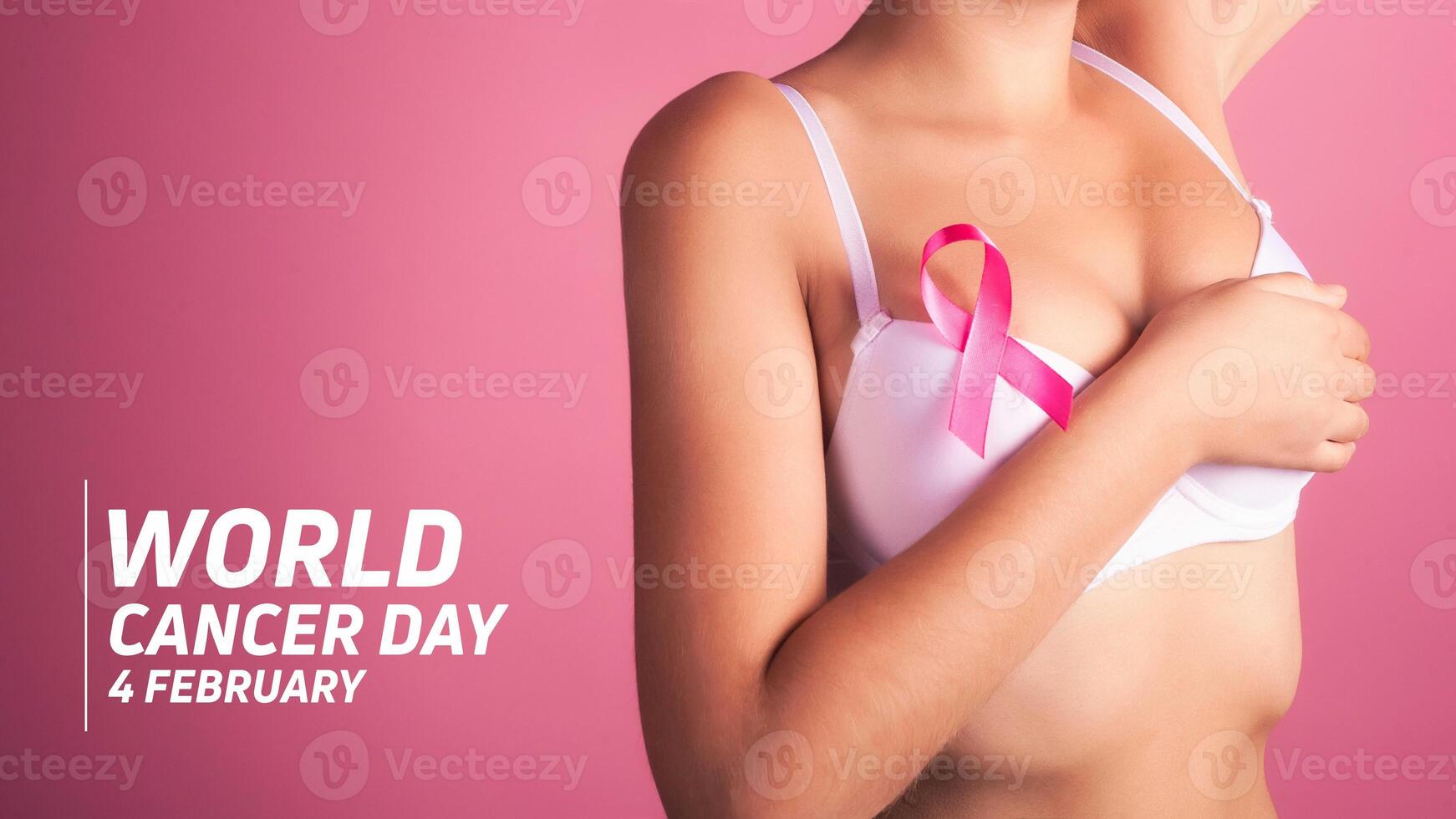 World cancer day concept background. Young woman examining her breast for lumps or signs of breast cancer. Pink Ribbon. photo