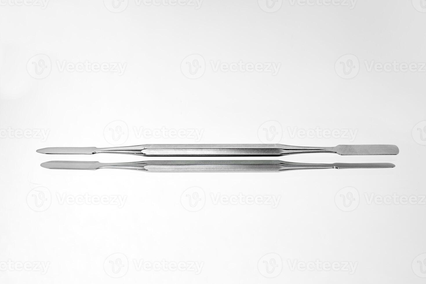 Dentist tools on white background photo