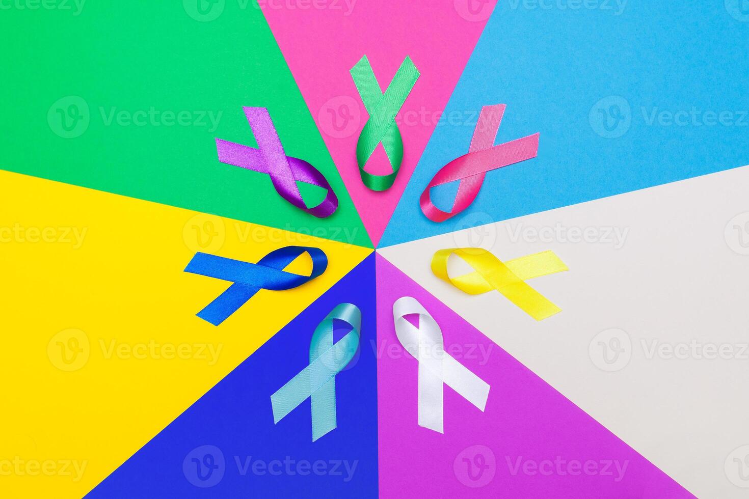 World cancer day background. Colorful ribbons, cancer awareness. multi-colored surface. photo