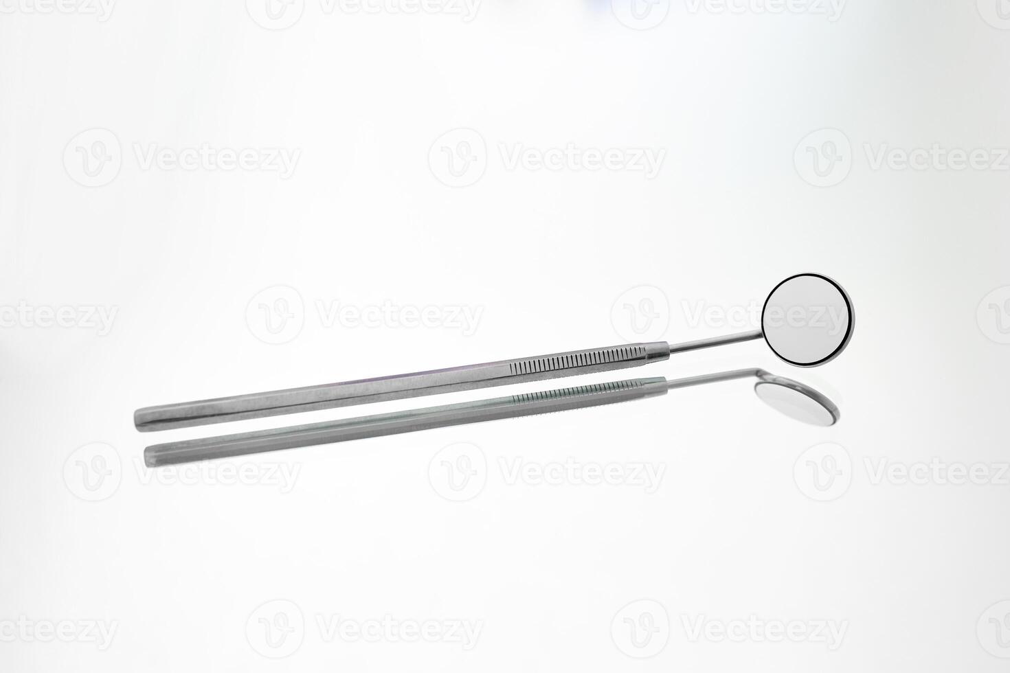 Dentist tools on white background photo