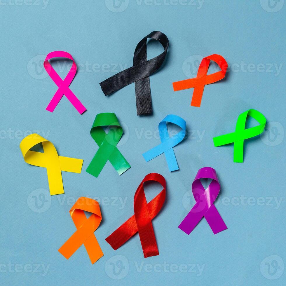 World Cancer Day. Colorful ribbons, cancer awareness, blue background. International Agency for Research on Cancer photo