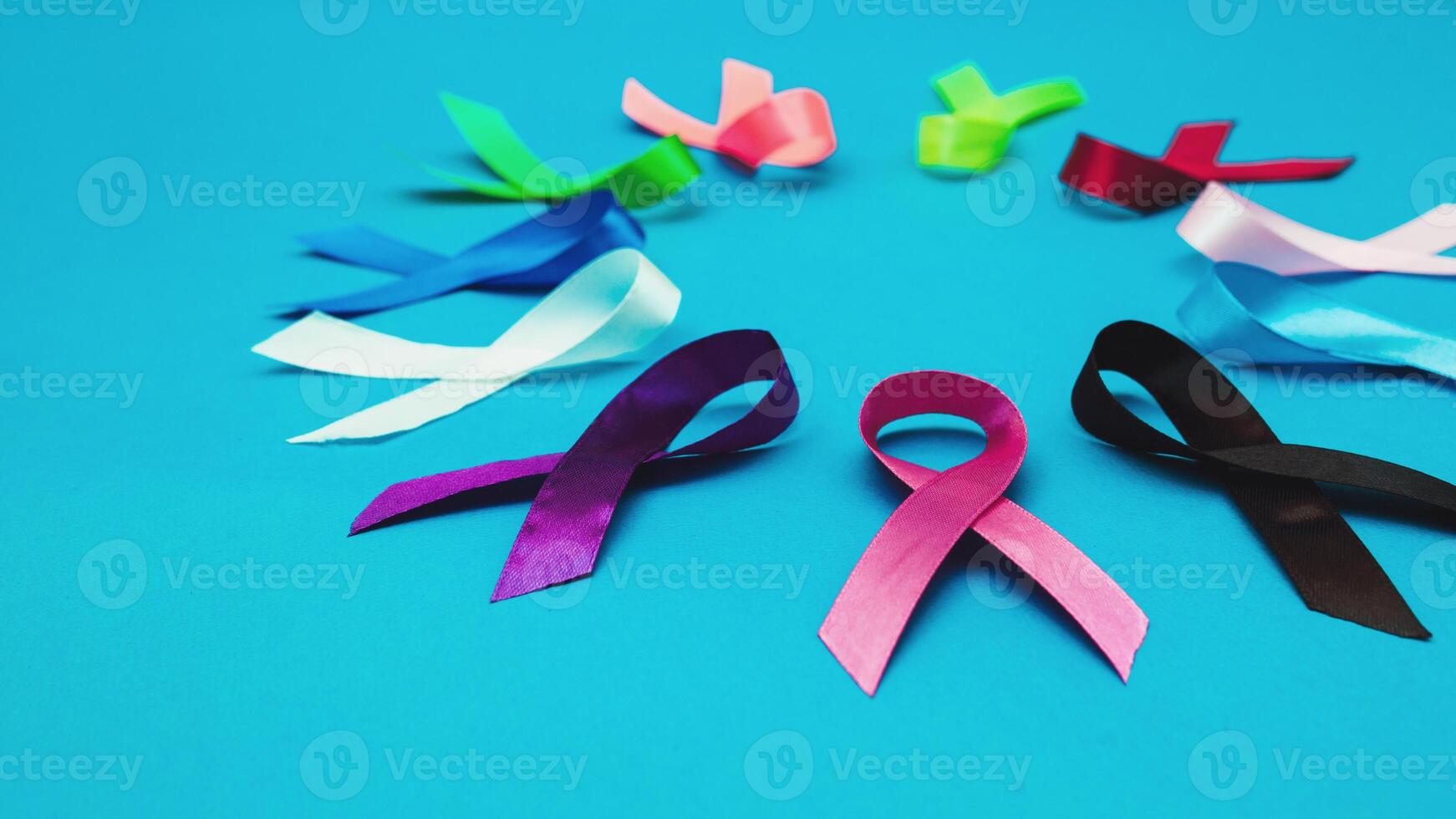 World cancer day February 4 background. Colorful ribbons, cancer awareness. blue surface from above photo