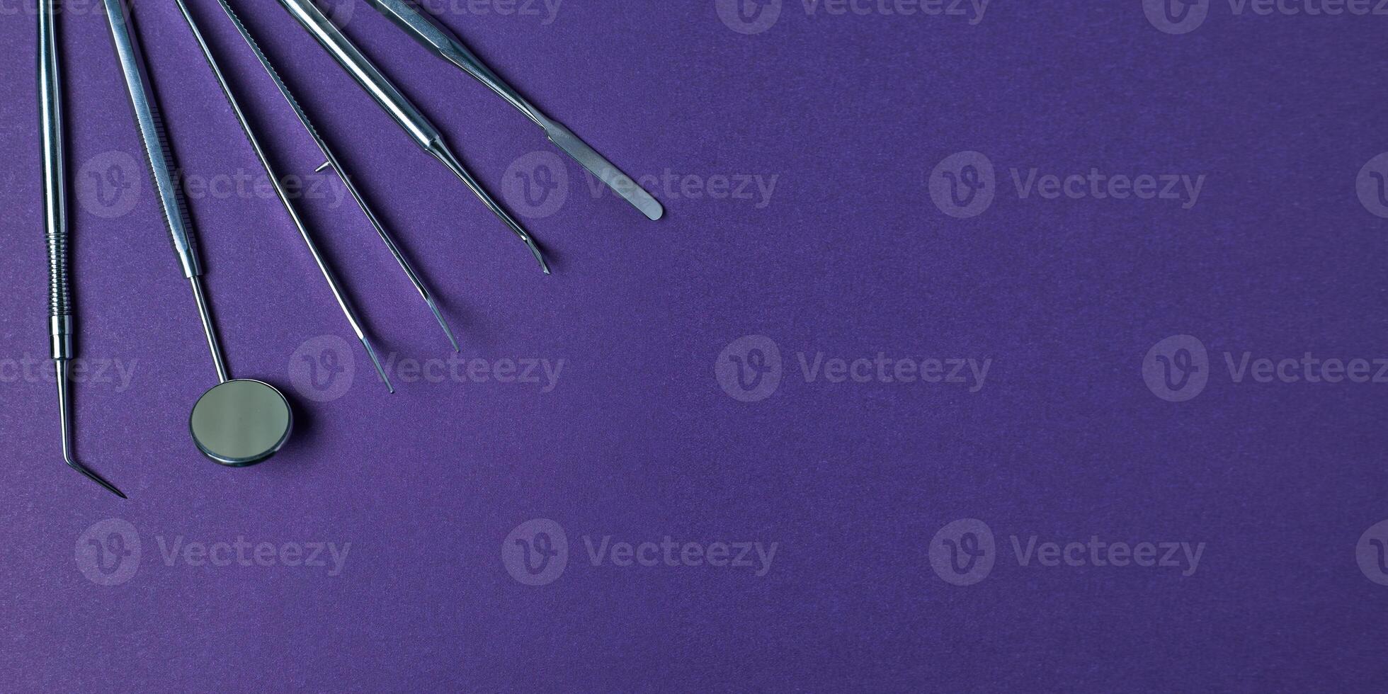 Dentist tools. Professional steel dental instruments with background with free space. photo