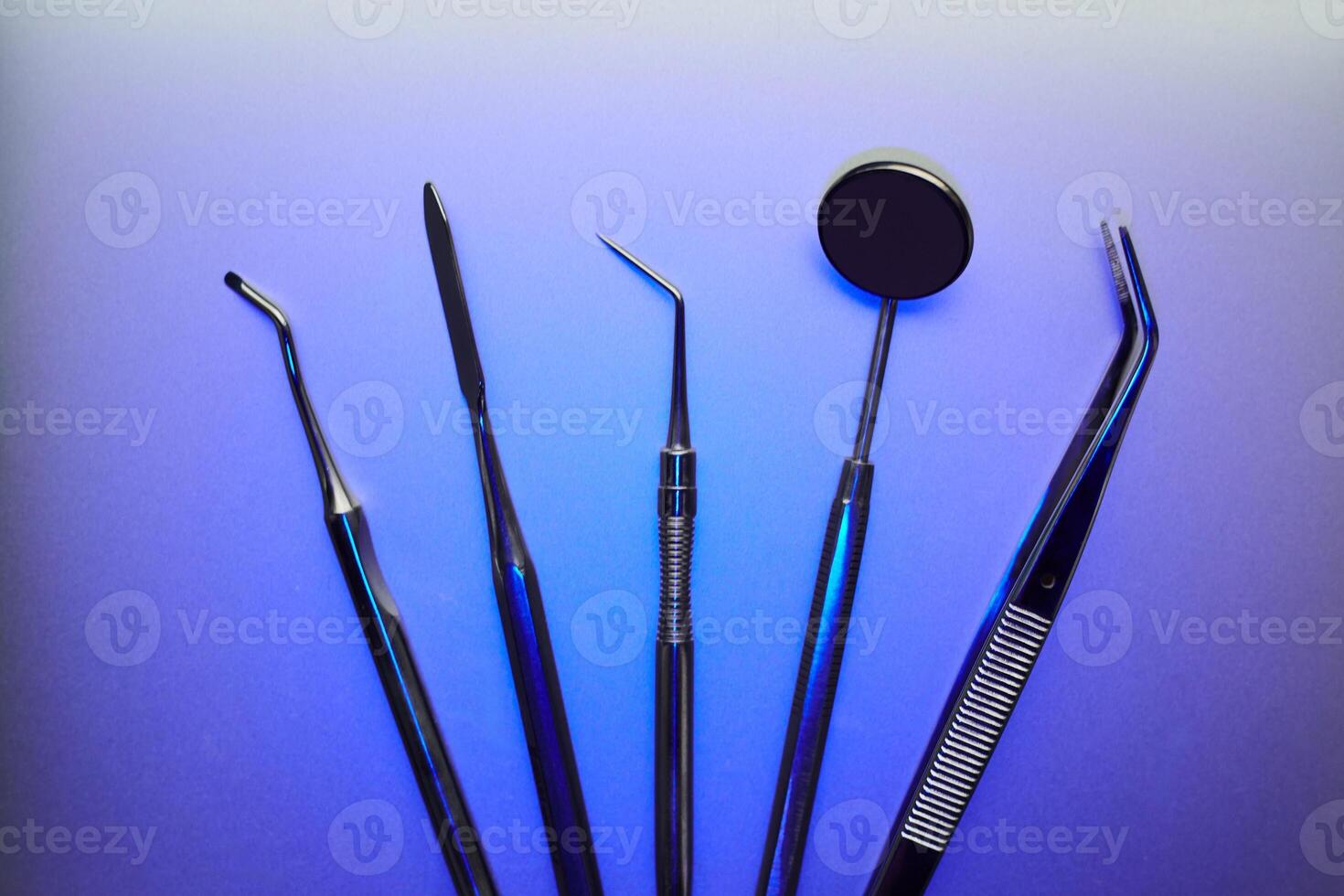 Dental tools on color background photo