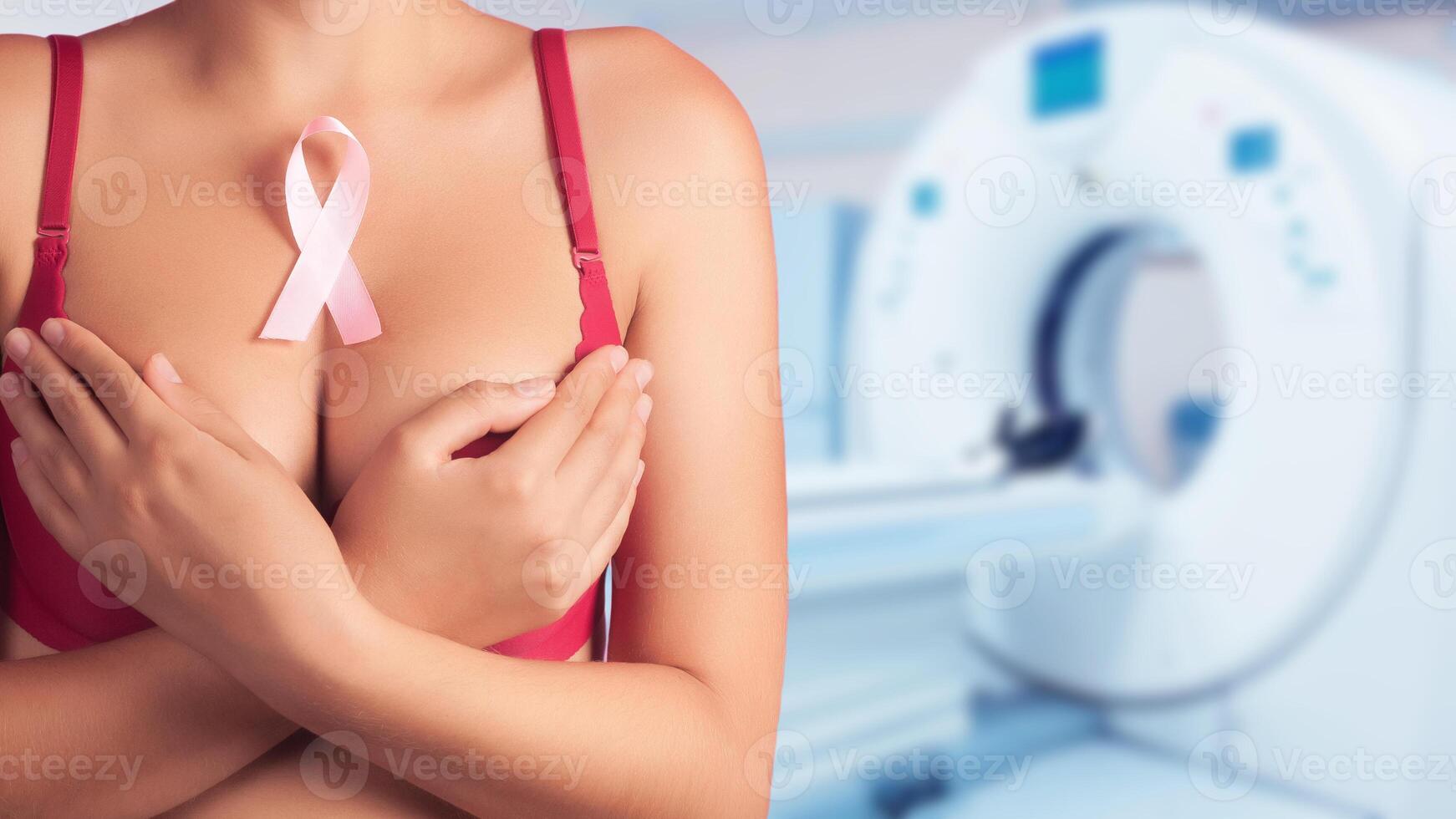 Breast cancer prevention concept. Background of female breasts in a bra in the office of mammography photo