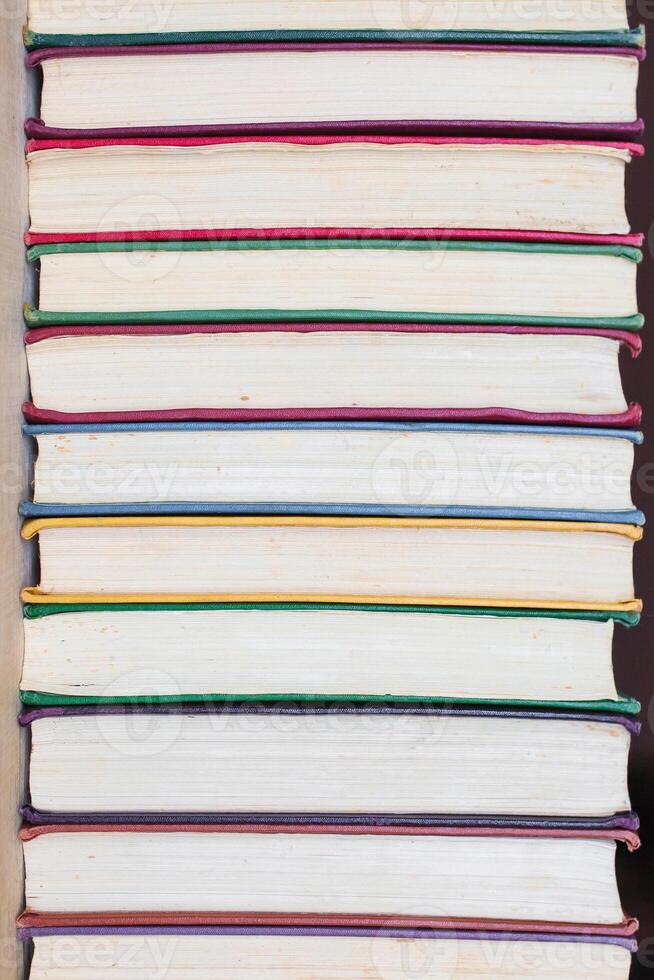 Background of multicolored roots of old books. Copy space. photo