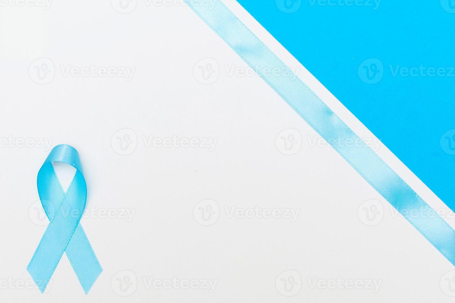 blue cancer awareness ribbon with trail on white background. photo