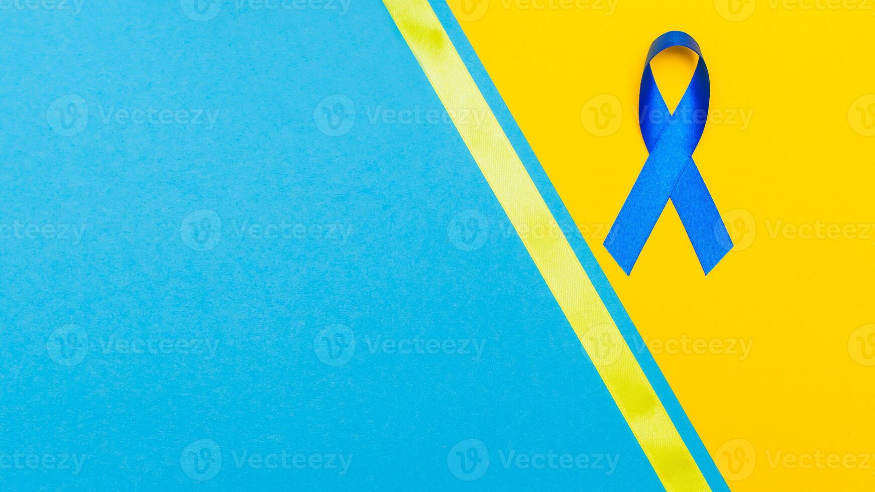 Dark blue ribbon awareness for aids day concept. yellow-blue background photo