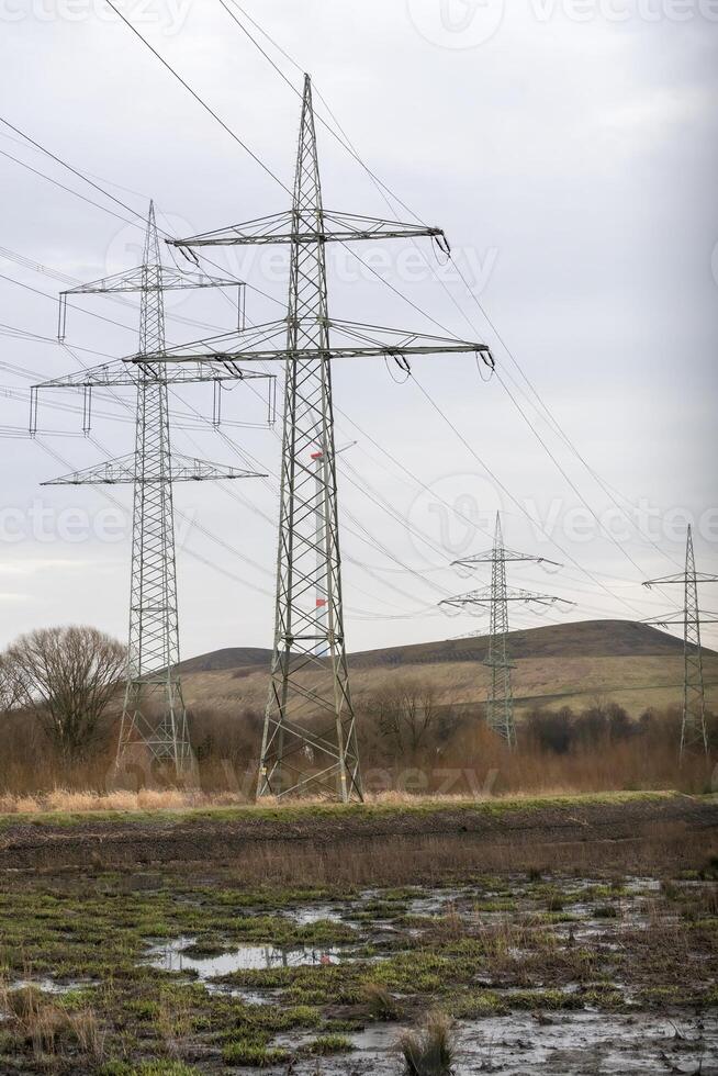 high-voltage pylons  in german industrial landscape photo