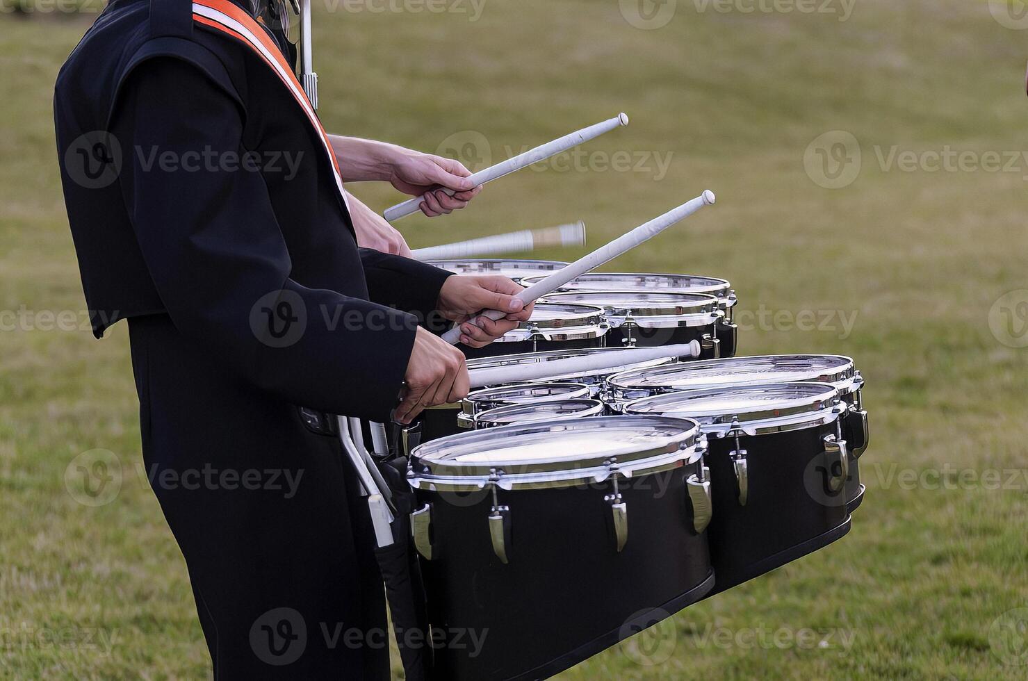 two marching band snare players warming up pregame photo