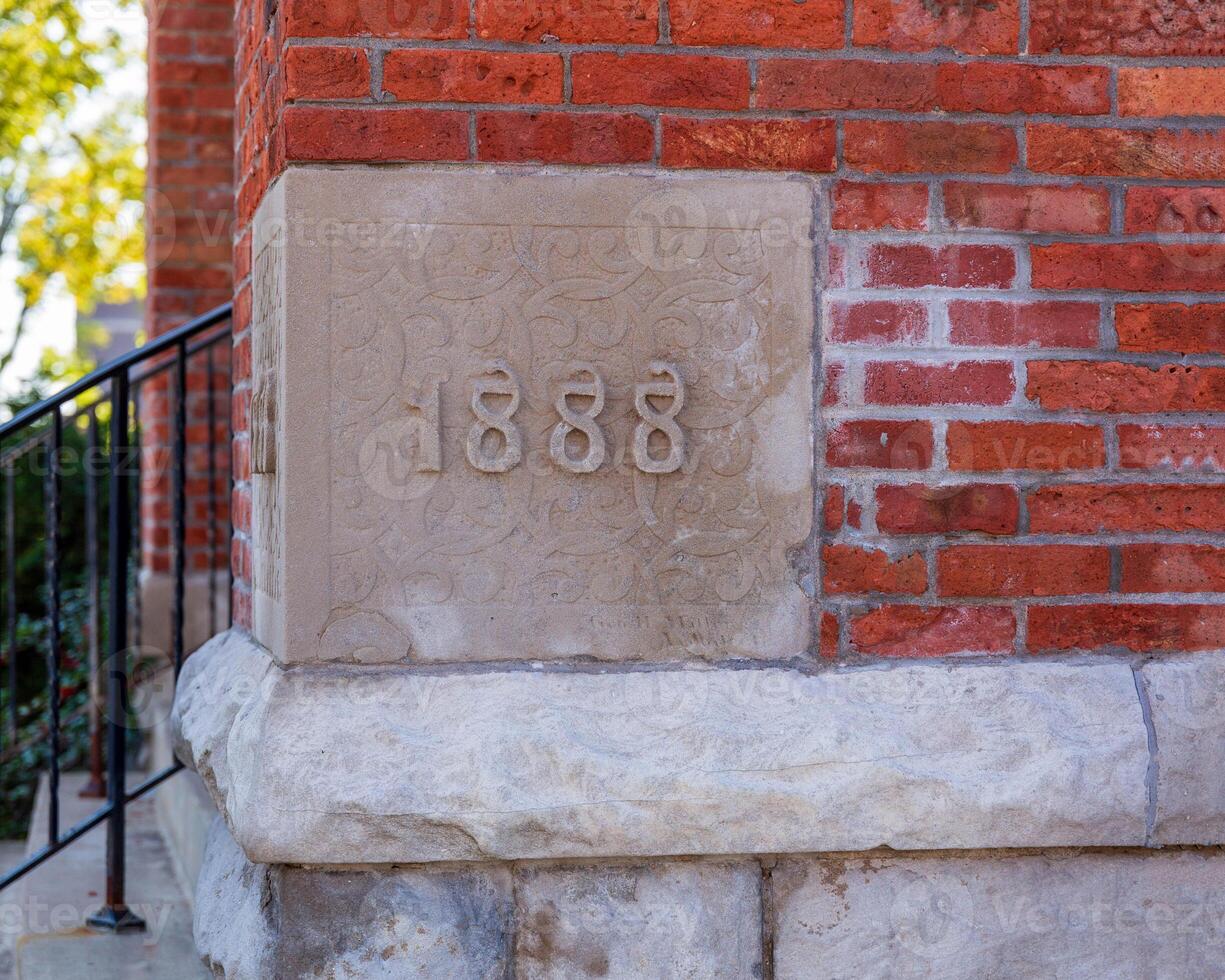 the building cornerstone of a very old but well maintained  church photo