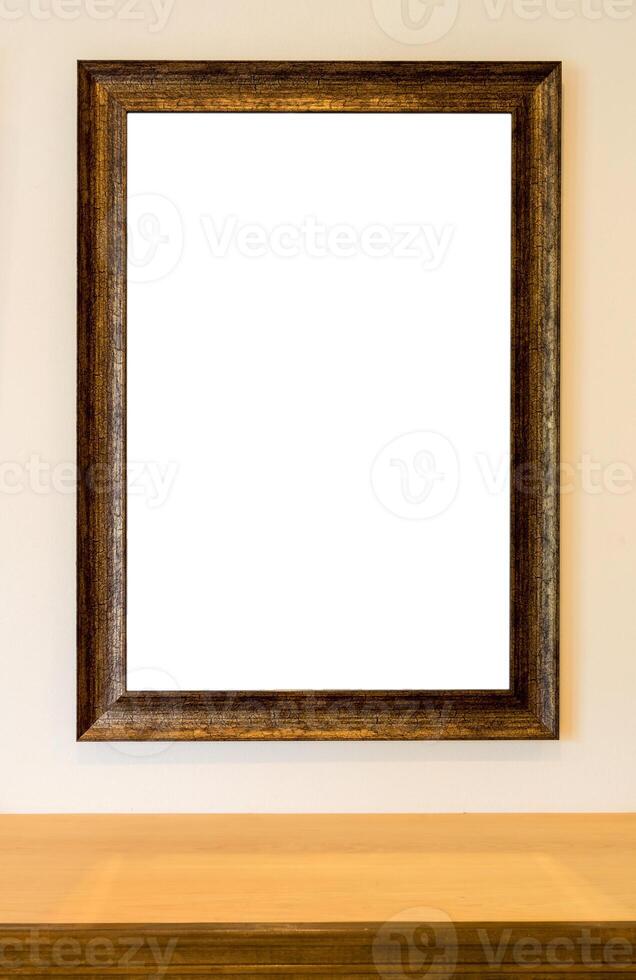 The blank wooden picture frame on the wall photo
