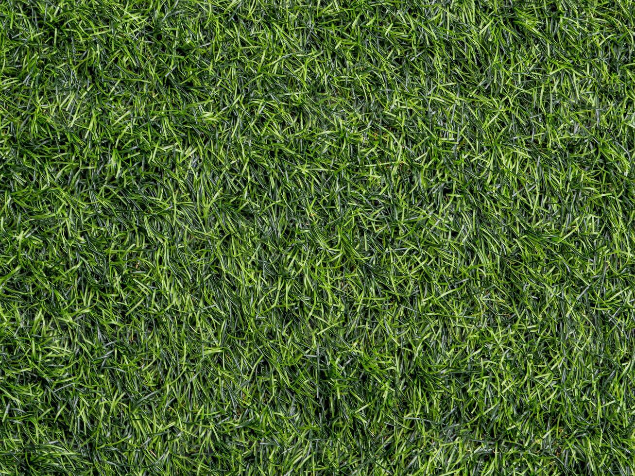 Texture of plastic artificial grass of school yard photo