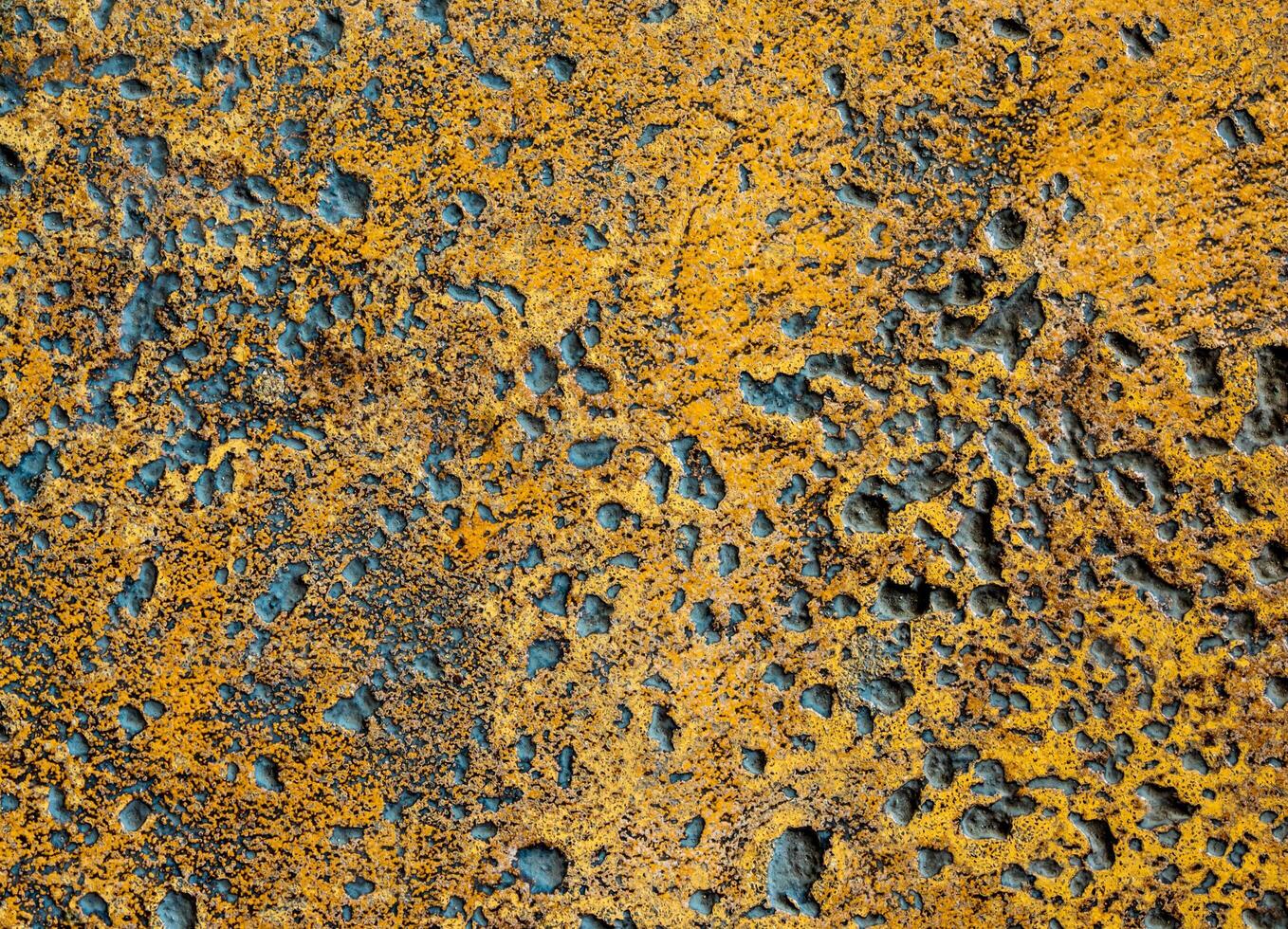 Many rugged holes on the rusty color concrete floor photo