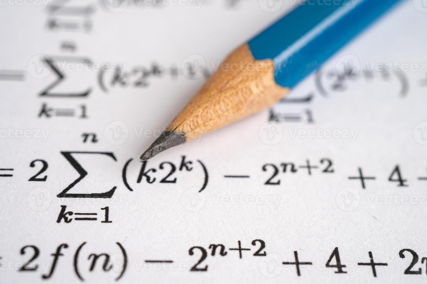 Pencil on mathematic formula exercise test paper in education school. photo