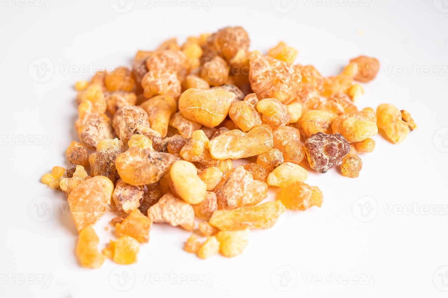 Frankincense or olibanum aromatic resin isolated on white background used in incense and perfumes. photo