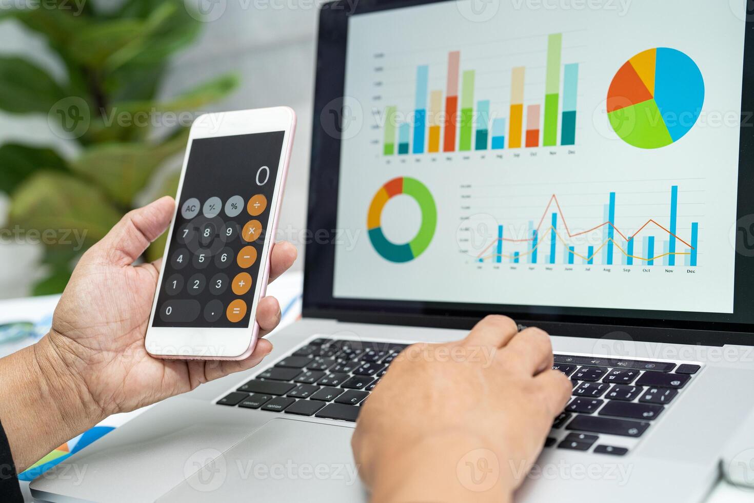 Asian accountant working and analyzing financial reports project accounting with chart graph and calculator in modern office, finance and business concept. photo