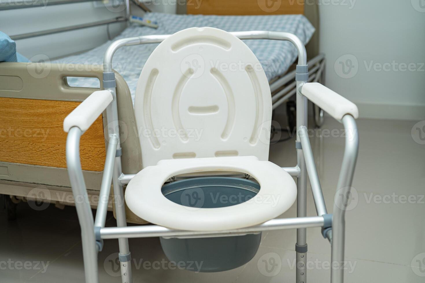 Flush toilet and shower chair in bathroom for old elder people. photo