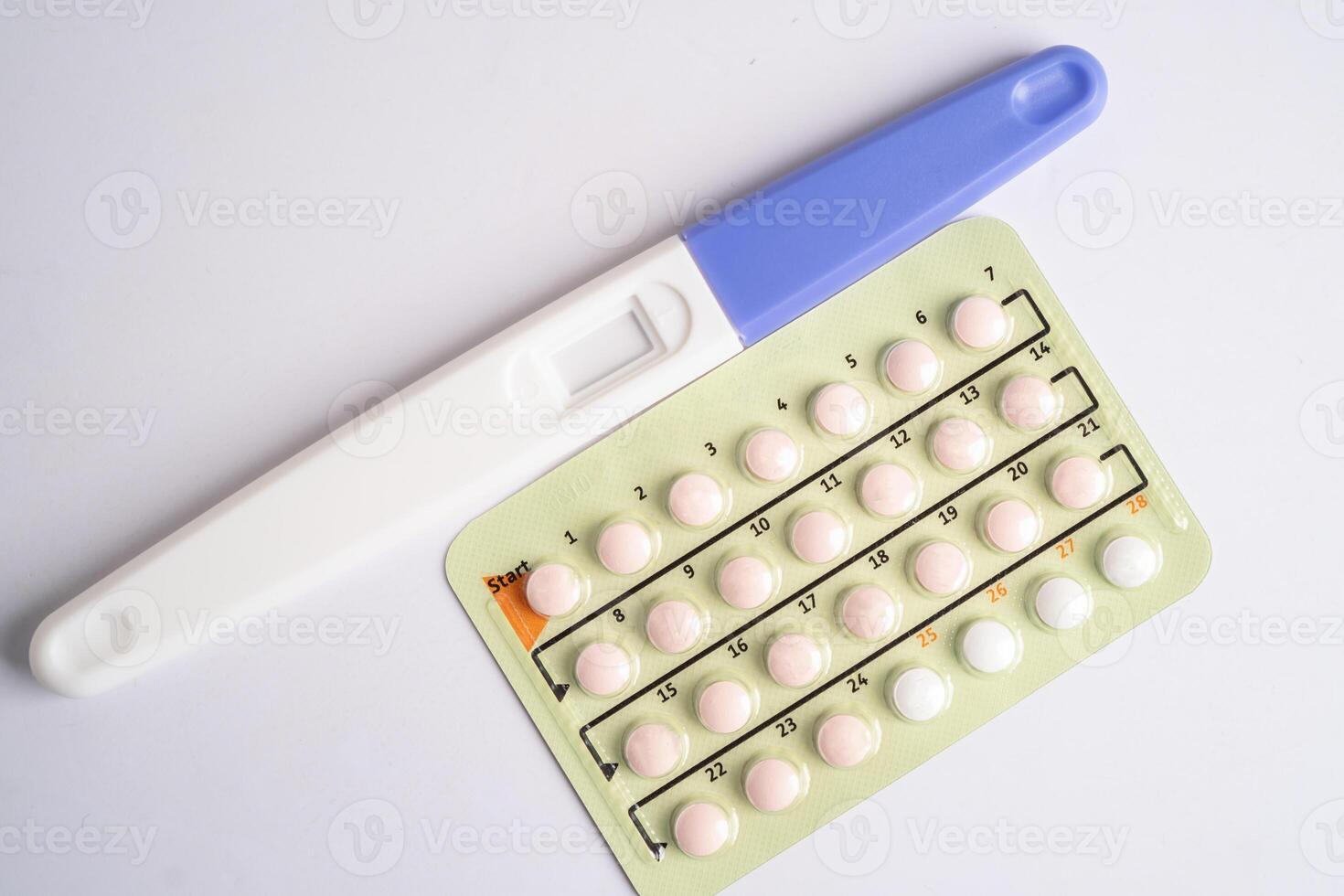 Pregnancy test and birth control pills, contraception health and medicine. photo