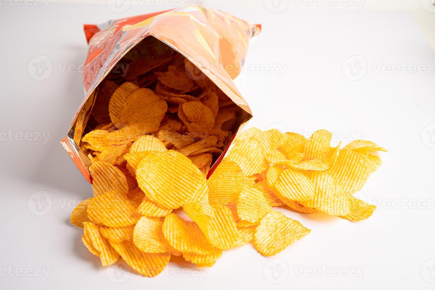 Potato chips, delicious BBQ seasoning spicy for crips, thin slice deep fried snack fast food in open bag. photo