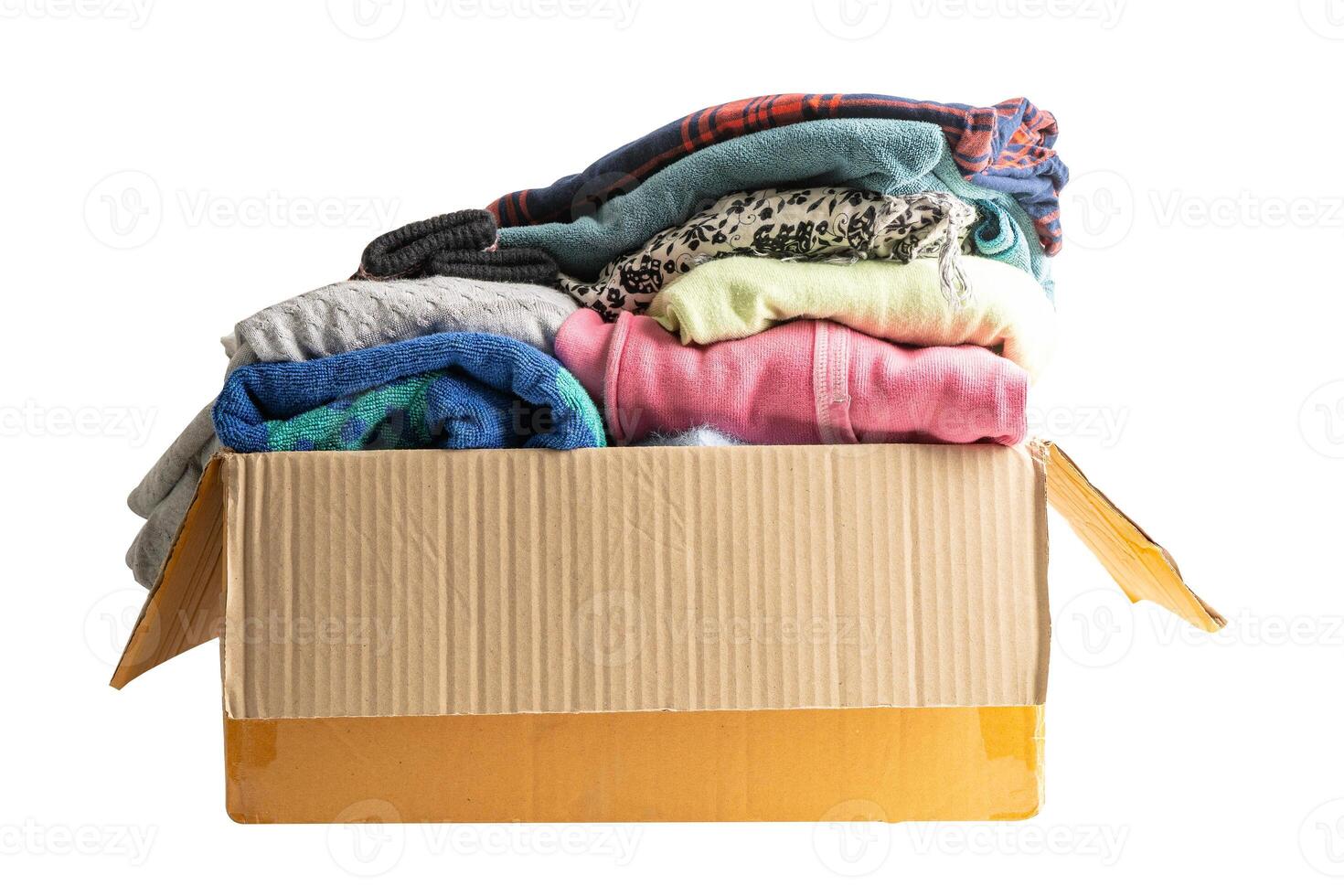 Donation box with used clothes isolated on white background with clipping path to support help for poor people in the world. photo