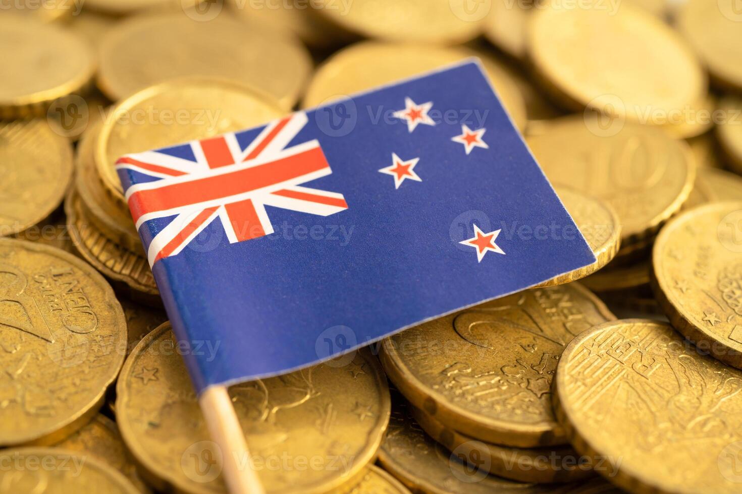 New Zealand flag on coins money, finance and accounting, banking. photo