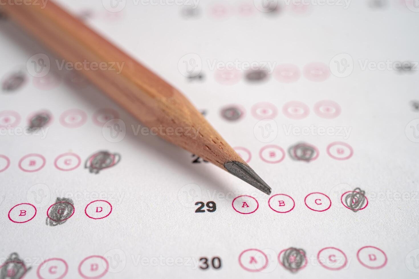 Answer sheets with pencil drawing fill to select choice, education concept. photo